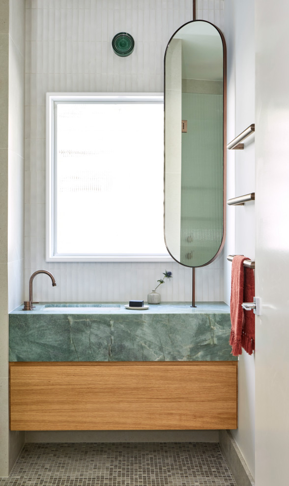Photo of a modern bathroom in Other with flat-panel cabinets, medium wood cabinets, white tile, white walls, mosaic tile floors, an undermount sink, grey floor, green benchtops, a single vanity and a floating vanity.