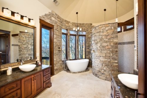 Large country master bathroom in Other with flat-panel cabinets, medium wood cabinets, a freestanding tub, an open shower, beige tile, ceramic tile, yellow walls, ceramic floors, a vessel sink and granite benchtops.