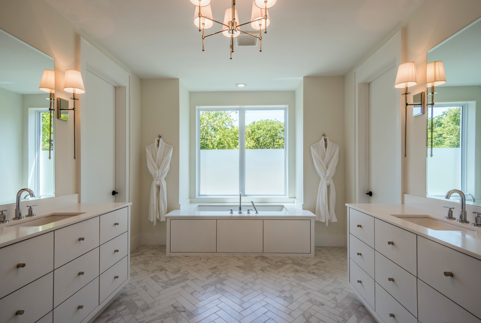 Large contemporary master bathroom in Dallas with flat-panel cabinets, white cabinets, an undermount tub, white tile, porcelain tile, white walls, porcelain floors, an undermount sink and quartzite benchtops.