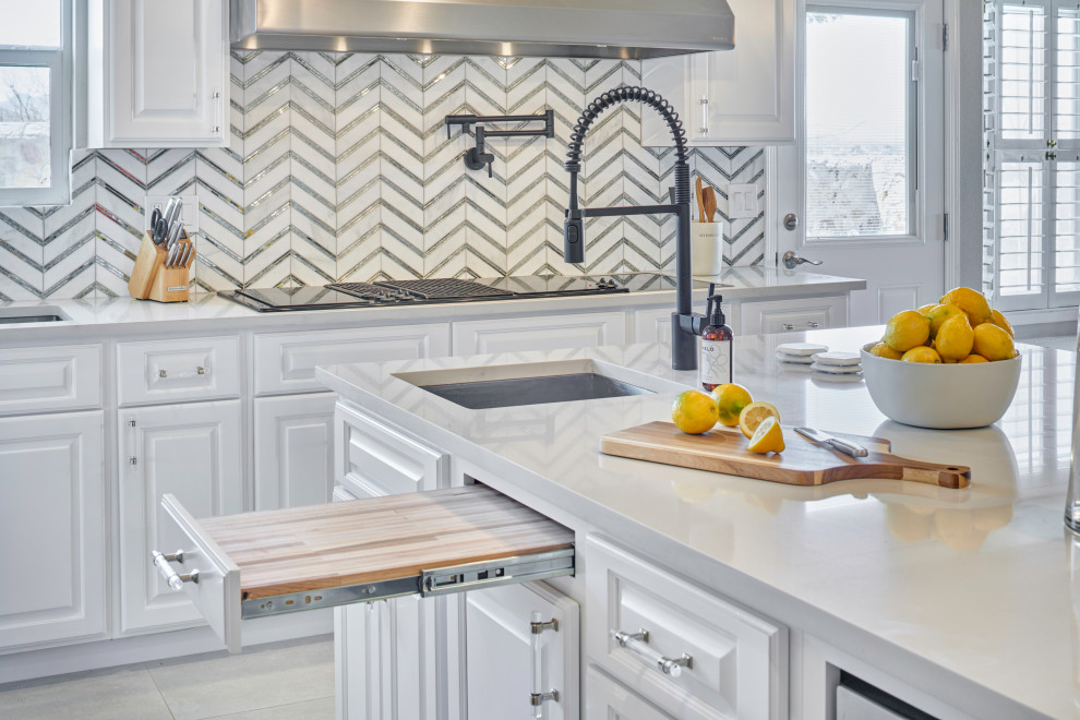Inspiration for a small transitional l-shaped porcelain tile and gray floor eat-in kitchen remodel with an undermount sink, beaded inset cabinets, white cabinets, quartzite countertops, multicolored backsplash, glass sheet backsplash, black appliances, a peninsula and white countertops