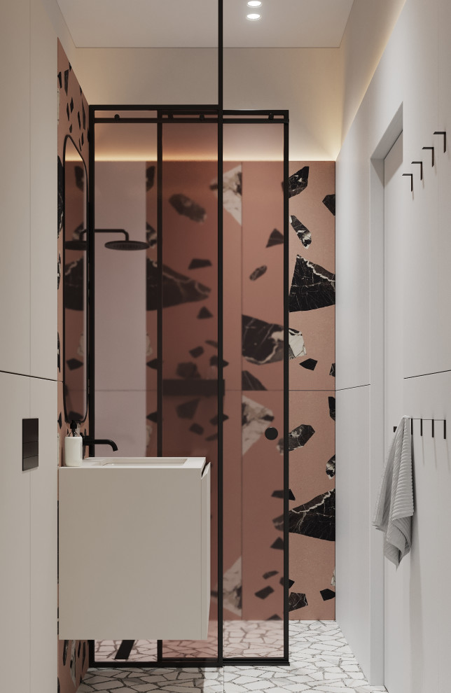 Пример оригинального дизайна: узкая и длинная ванная комната среднего размера в современном стиле с плоскими фасадами, бежевыми фасадами, душем в нише, инсталляцией, коричневой плиткой, керамической плиткой, разноцветными стенами, полом из керамогранита, душевой кабиной, врезной раковиной, столешницей из гранита, белым полом, душем с раздвижными дверями, белой столешницей, тумбой под одну раковину и подвесной тумбой