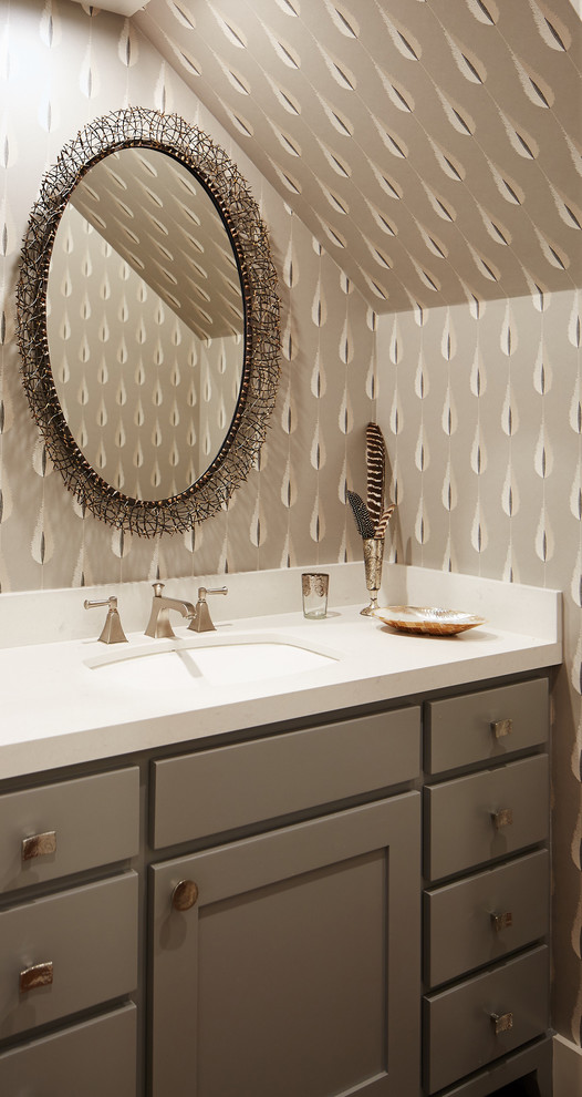 Design ideas for a large transitional powder room in San Francisco with shaker cabinets, grey cabinets, white tile, grey walls, an undermount sink, solid surface benchtops and white benchtops.