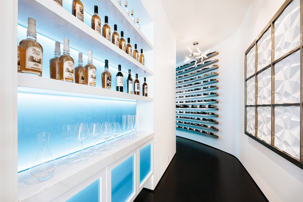 Expansive modern wine cellar in Portland with ceramic floors, display racks and black floor.
