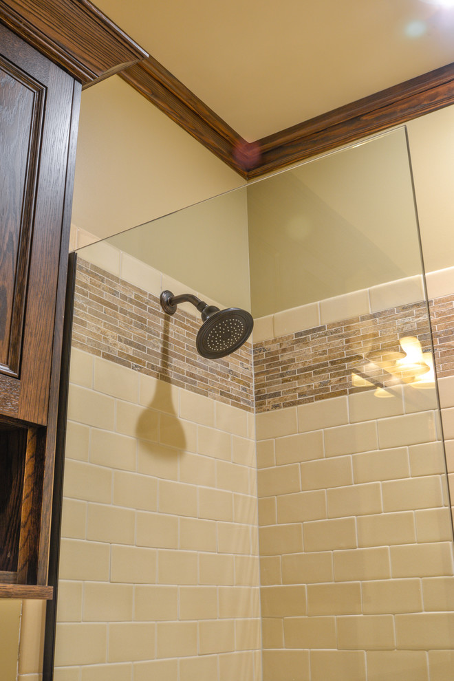 Mid-sized mountain style 3/4 beige tile and ceramic tile alcove bathtub photo with beige walls and a hinged shower door