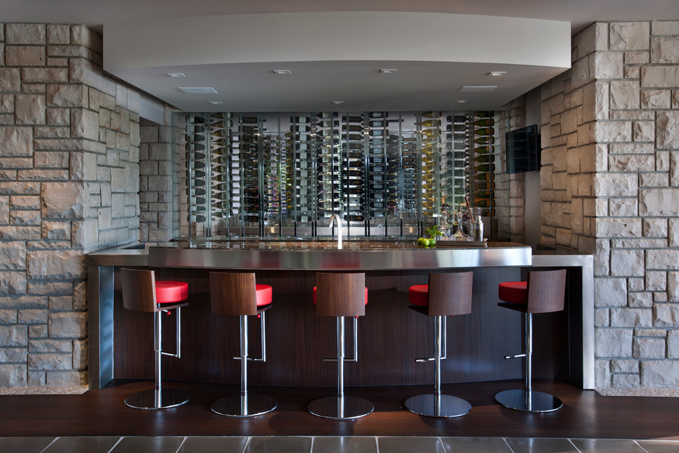 Contemporary seated home bar in Detroit with dark hardwood floors and stainless steel benchtops.