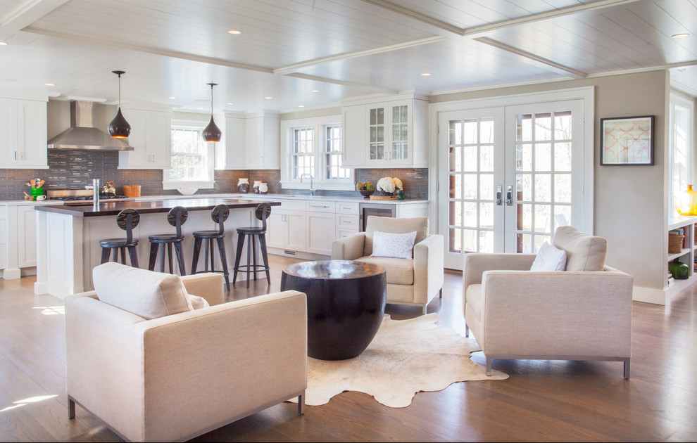 Inspiration for a mid-sized transitional u-shaped medium tone wood floor eat-in kitchen remodel with an undermount sink, shaker cabinets, white cabinets, marble countertops, gray backsplash, glass tile backsplash and stainless steel appliances