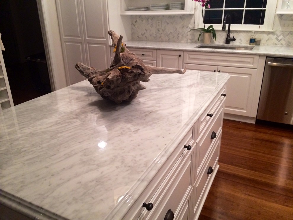 Huge transitional u-shaped dark wood floor eat-in kitchen photo in Charlotte with an undermount sink, raised-panel cabinets, white cabinets, granite countertops, gray backsplash, porcelain backsplash, stainless steel appliances and an island