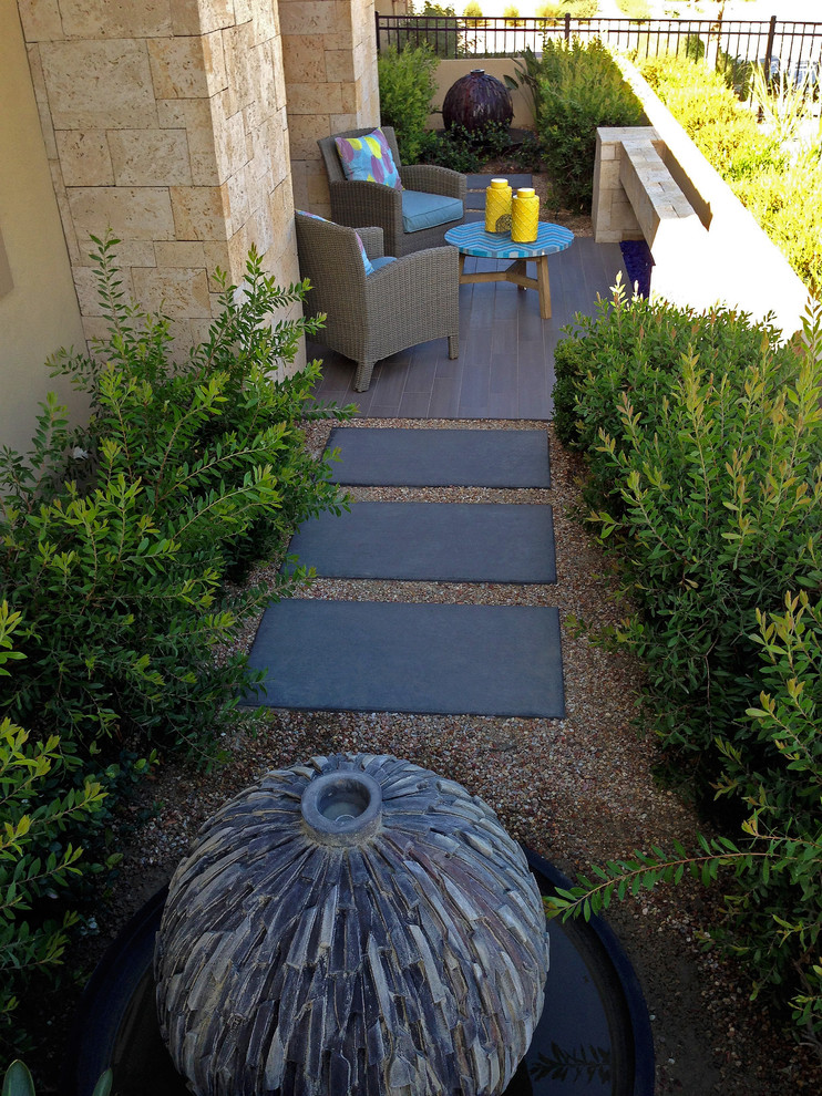 Inspiration for a large contemporary side yard patio in Phoenix with a fire feature, concrete pavers and no cover.