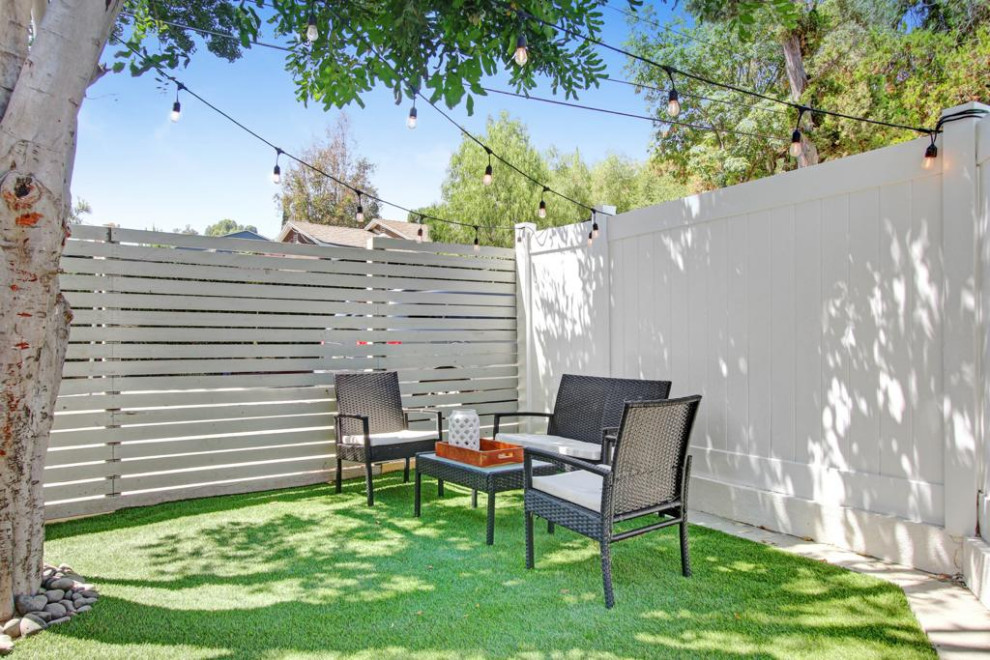 Inspiration for a mid-sized transitional backyard patio in Los Angeles with no cover.