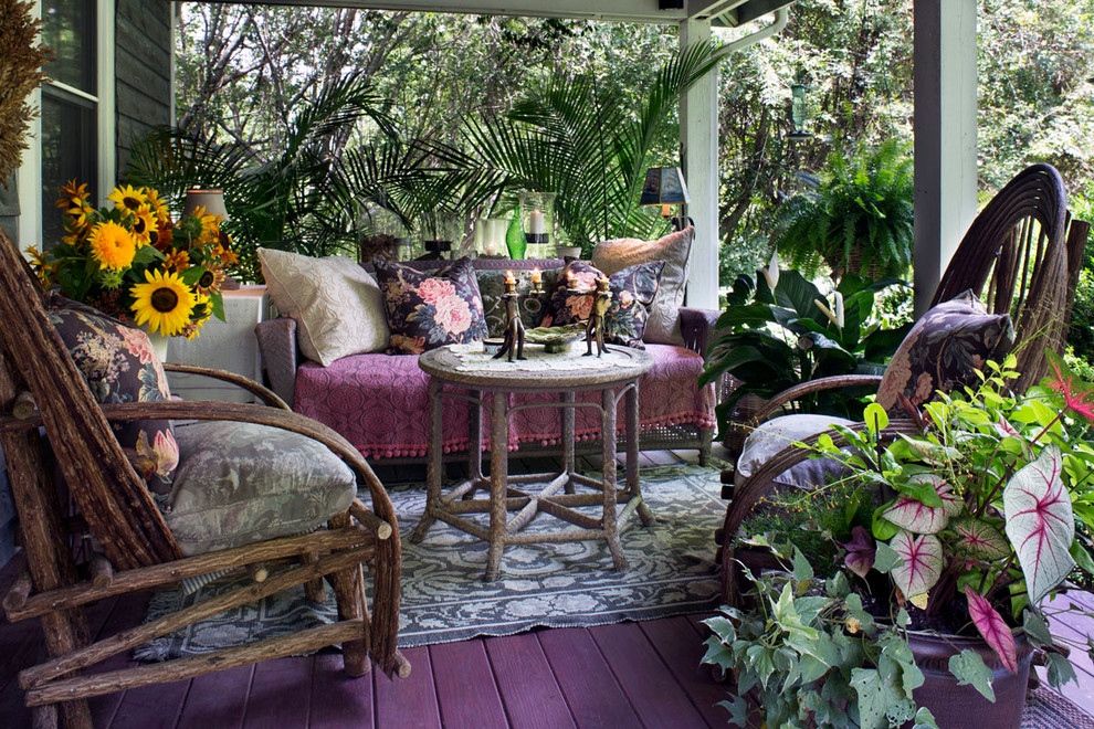 Photo of a small eclectic front yard verandah in Other with decking and a roof extension.