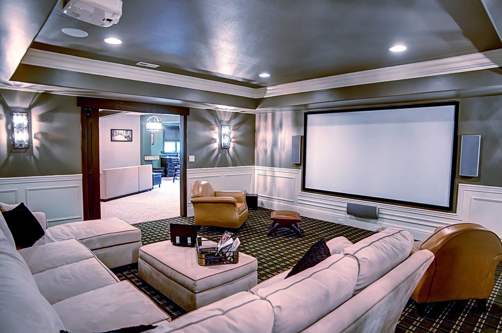 Photo of a mid-sized traditional enclosed home theatre in Other with green walls, carpet, a projector screen and green floor.