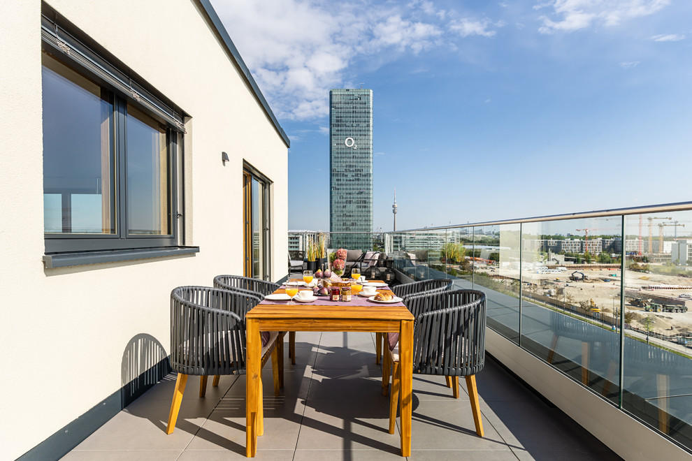 This is an example of a mid-sized contemporary rooftop and rooftop deck in Munich with no cover.