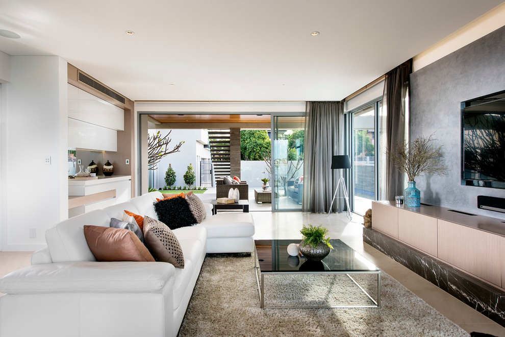 Expansive contemporary formal open concept living room in Perth with white walls, marble floors and a built-in media wall.
