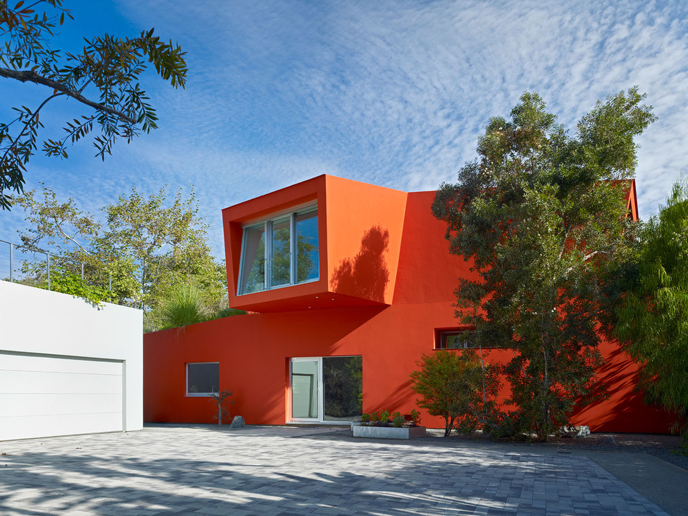 Contemporary two-storey red house exterior in Los Angeles.