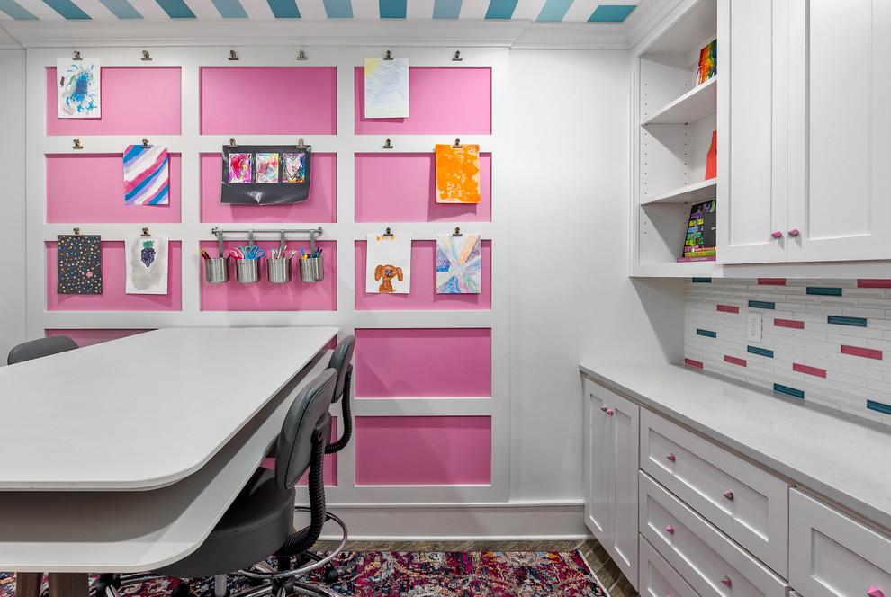 This is an example of a transitional gender-neutral kids' study room for kids 4-10 years old in Kansas City with pink walls.