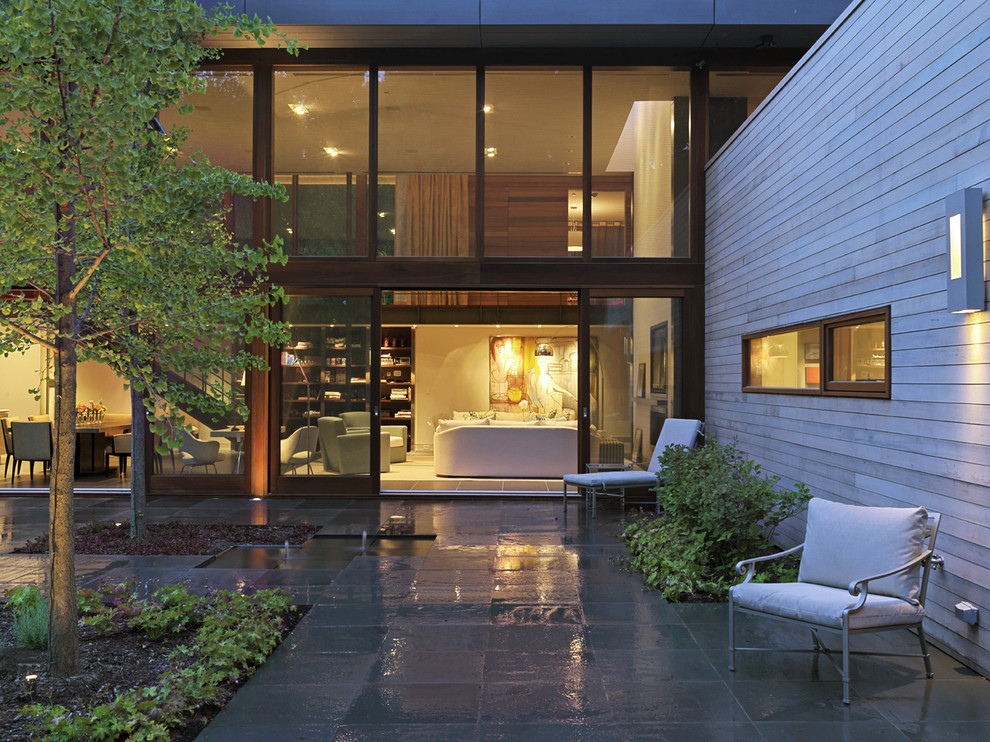 Photo of a contemporary exterior in Baltimore with wood siding.