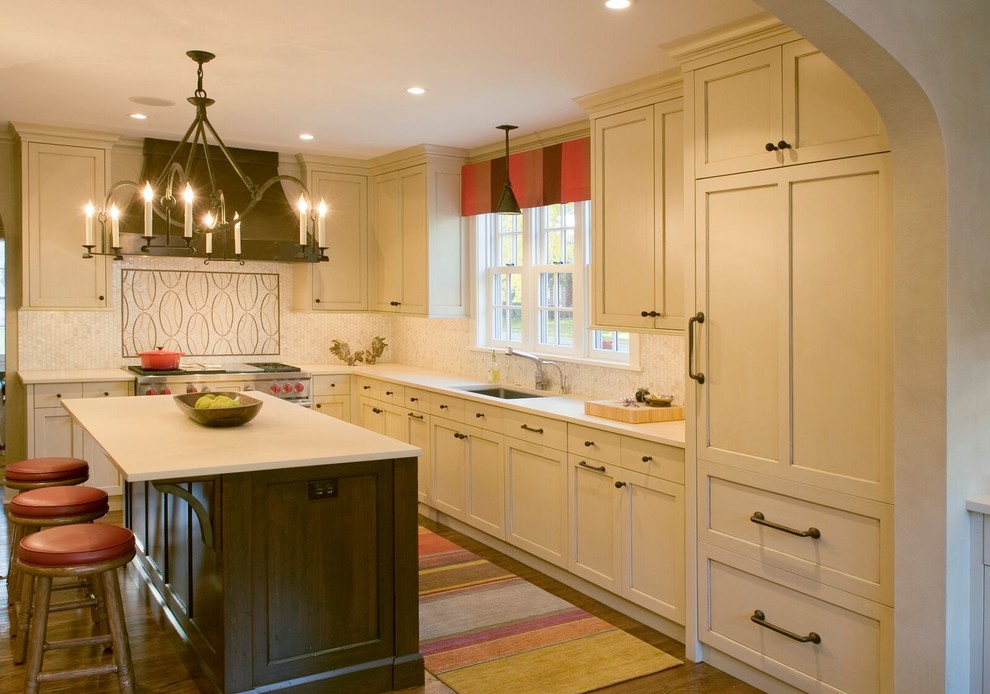 Large transitional l-shaped dark wood floor open concept kitchen photo in Minneapolis with a single-bowl sink, shaker cabinets, white cabinets, white backsplash, mosaic tile backsplash, paneled appliances and an island