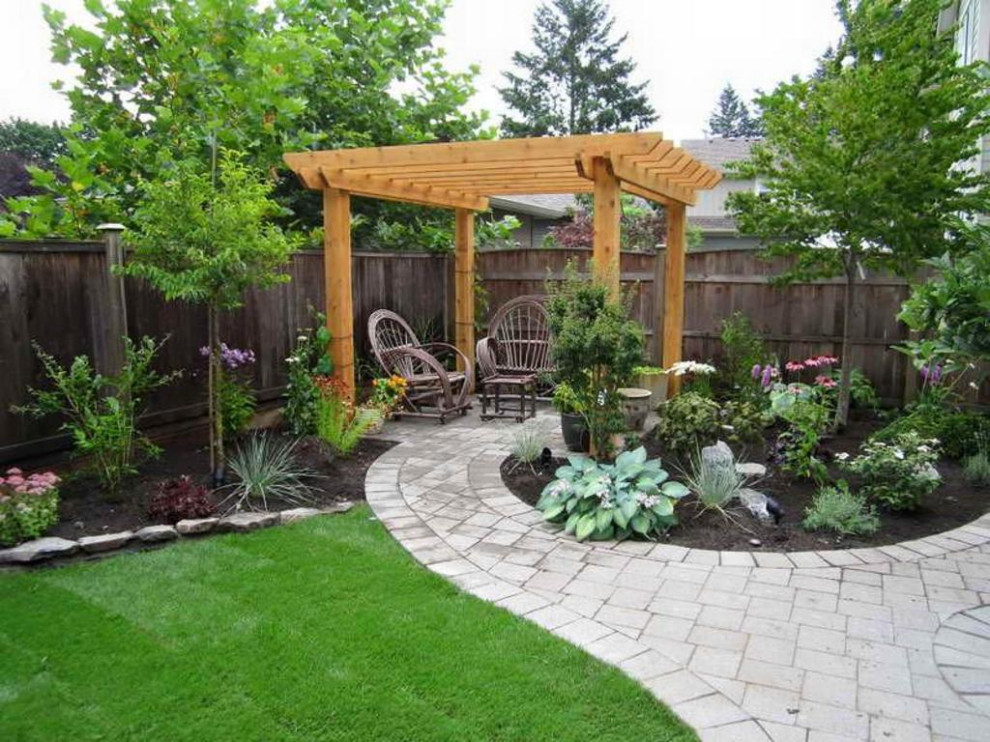 Idee per un giardino xeriscape chic esposto in pieno sole di medie dimensioni e dietro casa con recinzione in legno