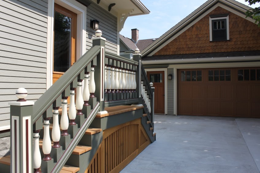 Example of a mid-sized minimalist entryway design with a medium wood front door