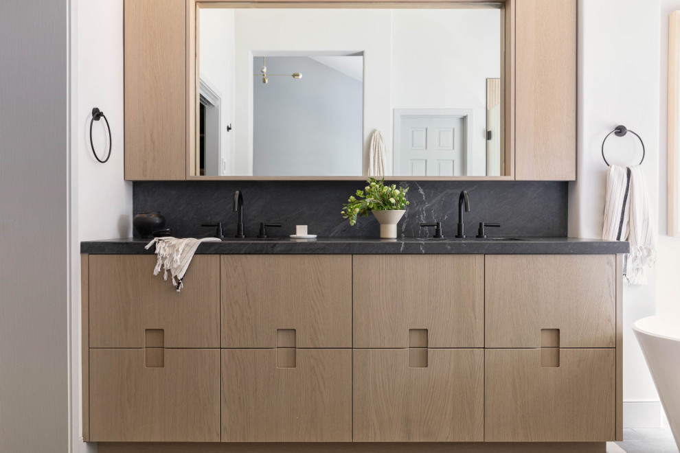 Inspiration for a mid-sized contemporary master double-sink bathroom remodel in San Francisco with flat-panel cabinets, brown cabinets, soapstone countertops, gray countertops and a built-in vanity
