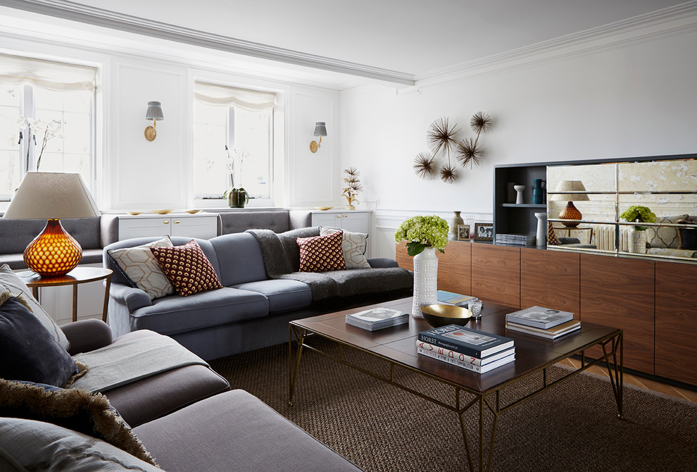 Design ideas for a contemporary living room in London with white walls, light hardwood floors and no tv.