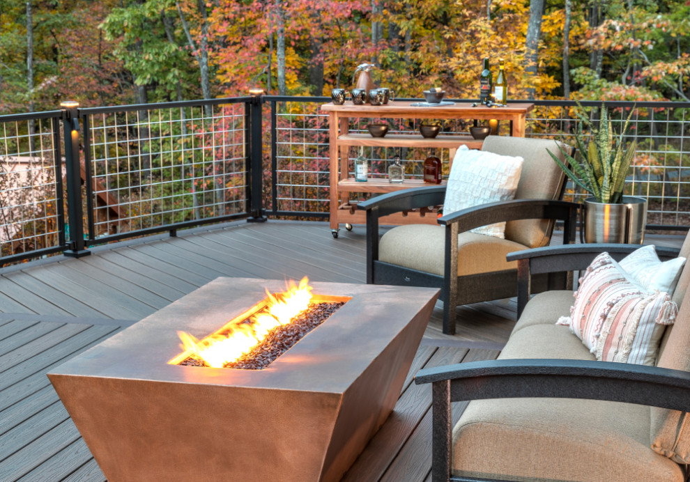 Inspiration for an arts and crafts backyard and first floor deck in DC Metro with a fire feature, no cover and metal railing.