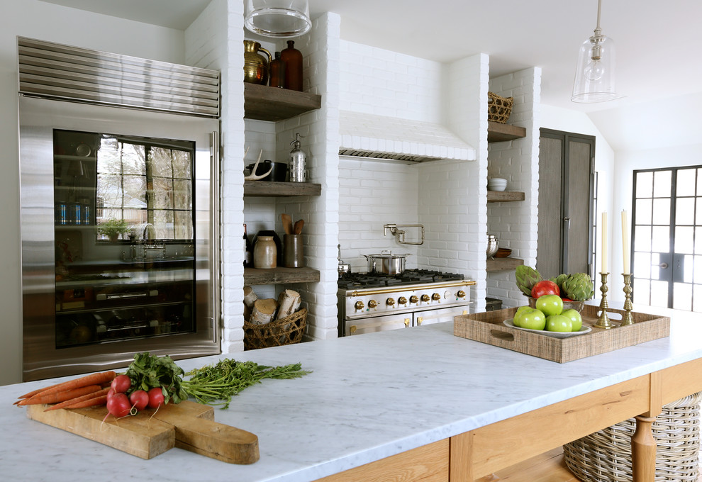 Design ideas for an eclectic kitchen in Chicago with stainless steel appliances.
