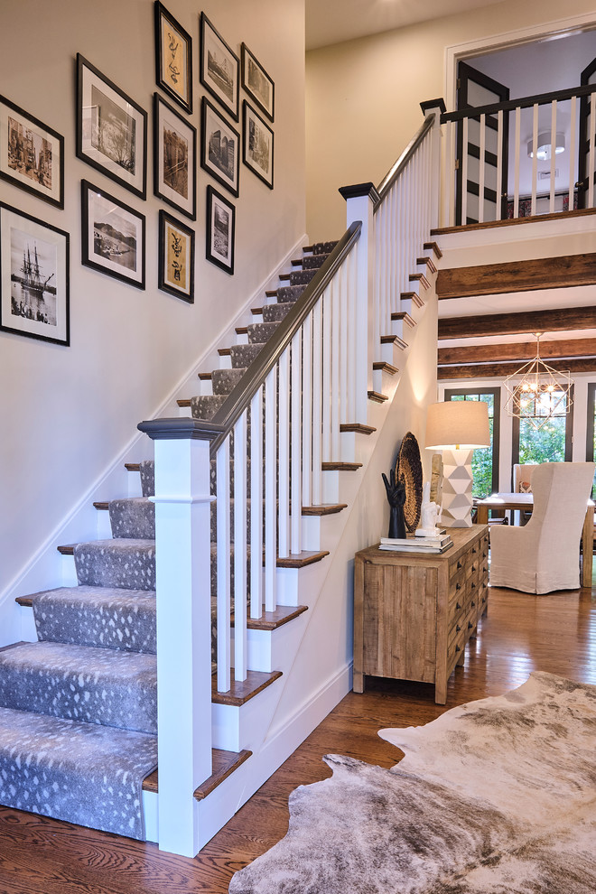 This is an example of a mid-sized transitional staircase in Boston.