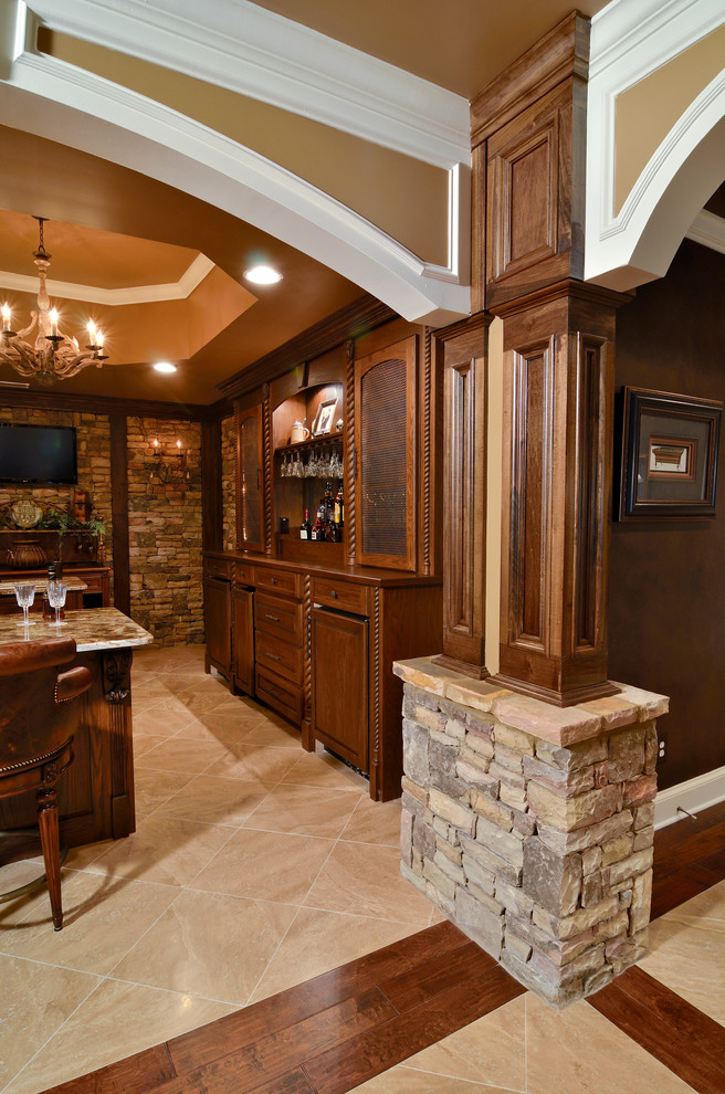 Photo of a large traditional home bar in Atlanta with travertine floors.