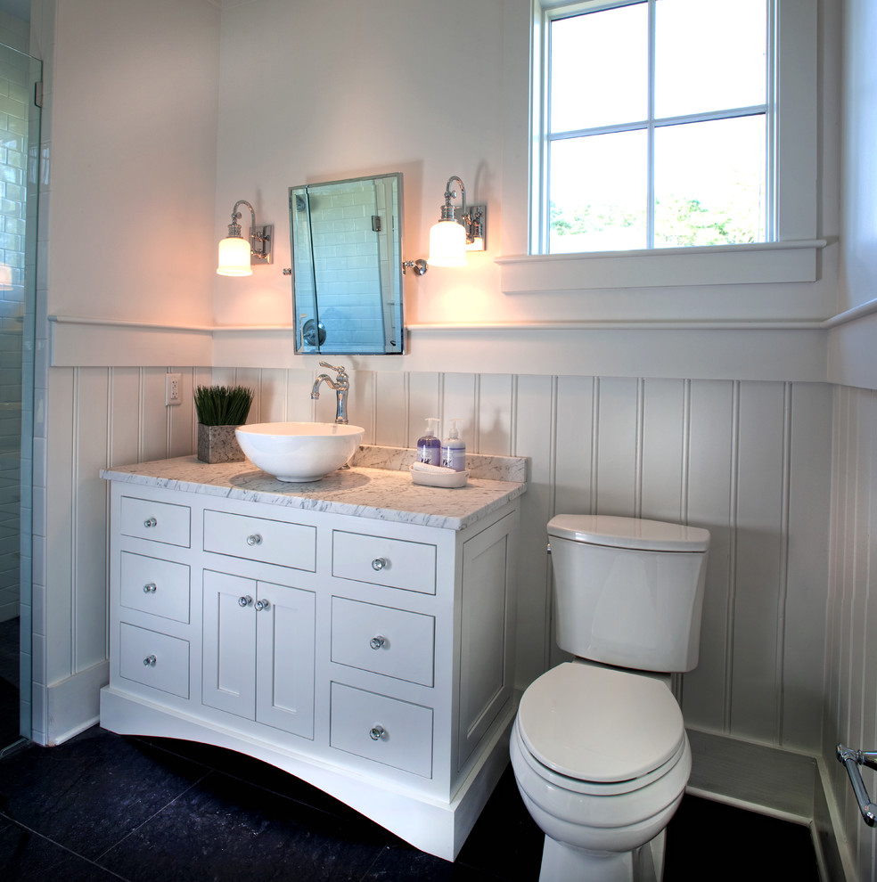Inspiration for a small country master bathroom in Atlanta with a vessel sink, white cabinets, marble benchtops, a two-piece toilet, gray tile, stone slab, white walls, porcelain floors and flat-panel cabinets.