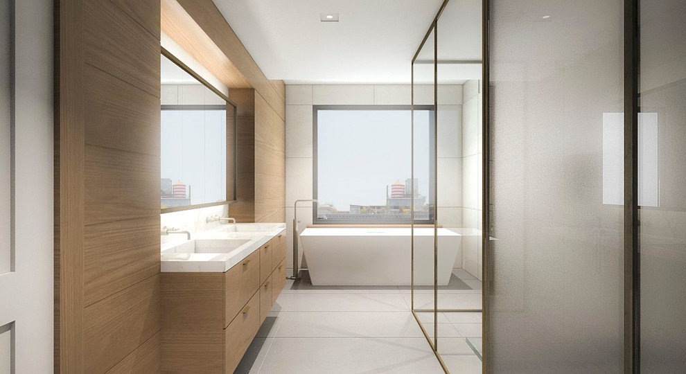 Design ideas for a large contemporary master bathroom in New York with flat-panel cabinets, medium wood cabinets, a freestanding tub, a double shower, porcelain tile, white walls, porcelain floors, an undermount sink, marble benchtops, white tile and a one-piece toilet.
