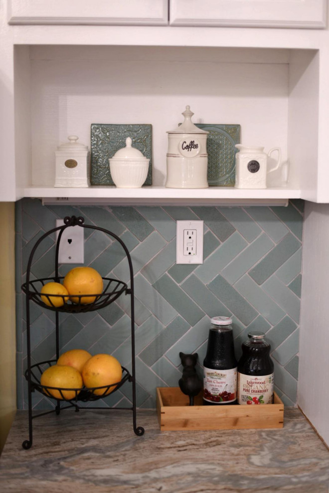 Inspiration for a small transitional u-shaped kitchen remodel in Bridgeport with white cabinets, granite countertops, green backsplash, ceramic backsplash, stainless steel appliances and multicolored countertops