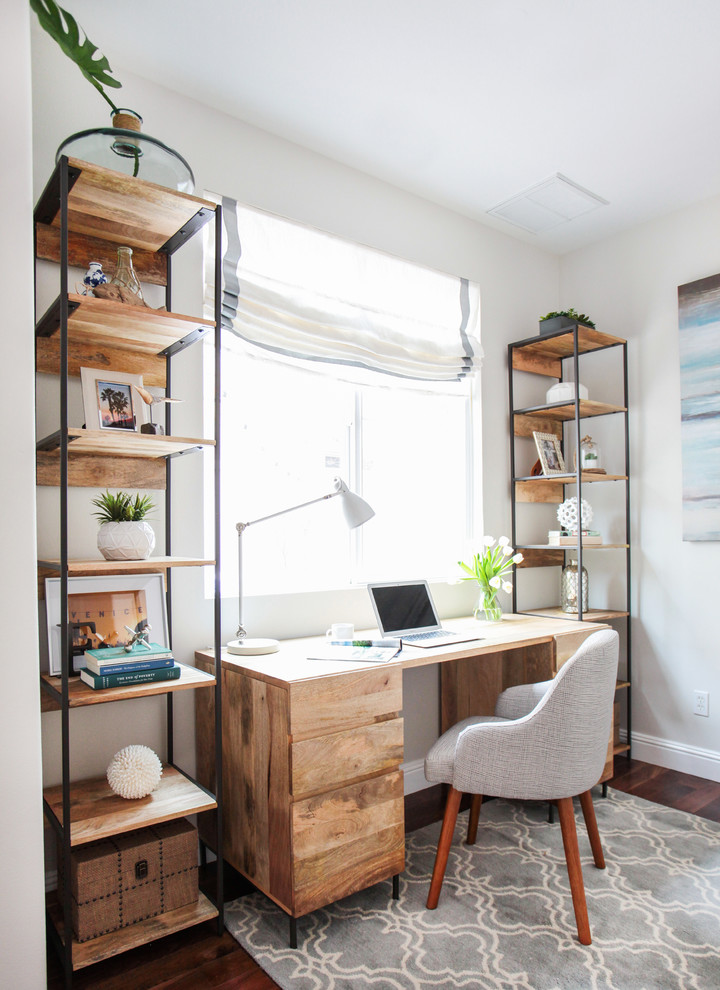 Photo of a beach style home office in Los Angeles with white walls, dark hardwood floors and a freestanding desk.