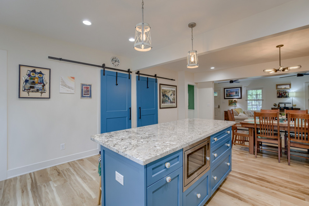 Small transitional l-shaped eat-in kitchen photo with recessed-panel cabinets, turquoise cabinets, quartz countertops and an island