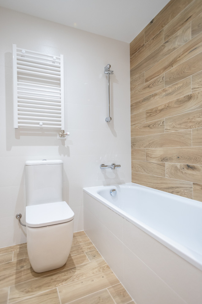 Example of a mid-sized danish master beige tile and ceramic tile ceramic tile, brown floor and single-sink bathroom design in Barcelona with flat-panel cabinets, a one-piece toilet, white countertops and a floating vanity