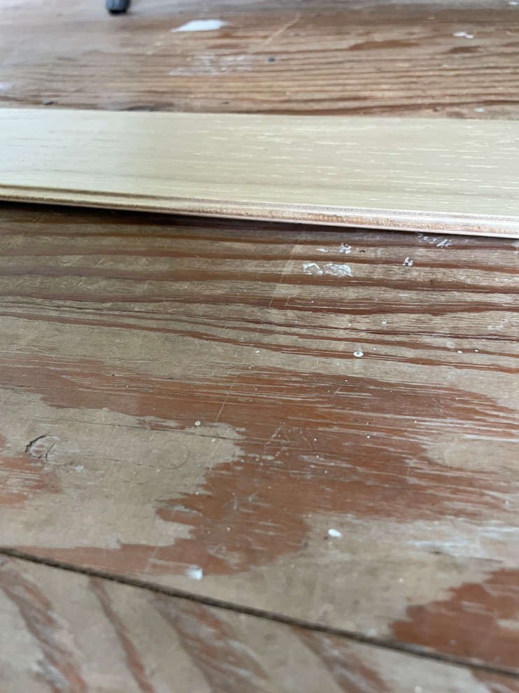 Leveling subfloor for engineered wood