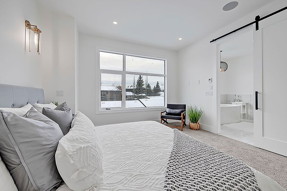 Example of a transitional home design design in Calgary