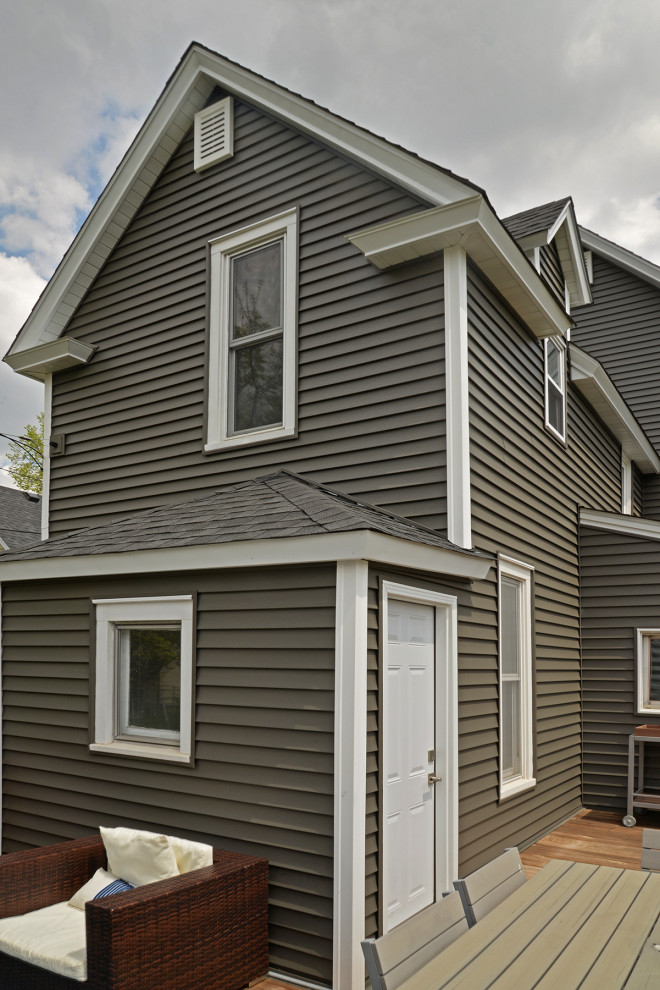 Inspiration for a mid-sized traditional two-storey grey house exterior in Minneapolis with mixed siding, a gable roof and a shingle roof.