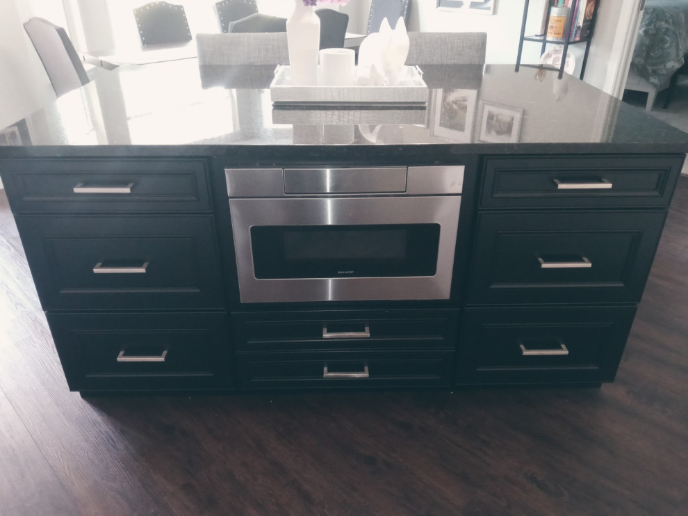 Inspiration for a mid-sized transitional kitchen remodel with recessed-panel cabinets, black cabinets, granite countertops, an island and black countertops
