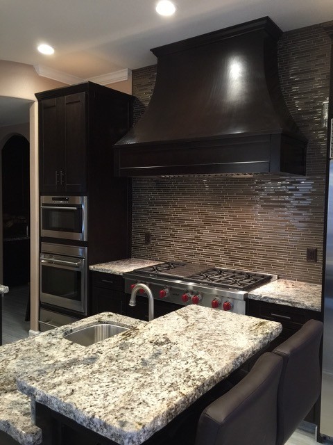 Kitchen - transitional kitchen idea in Orange County with a single-bowl sink, brown backsplash, mosaic tile backsplash and stainless steel appliances