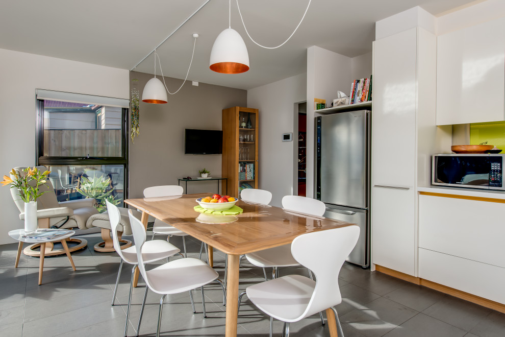 Example of a trendy kitchen/dining room combo design in Hobart
