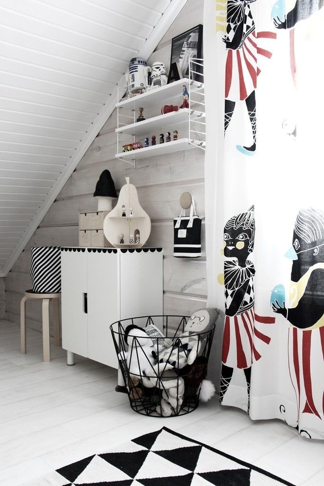 Design ideas for a mid-sized scandinavian gender-neutral kids' playroom for kids 4-10 years old in Other with white walls and light hardwood floors.