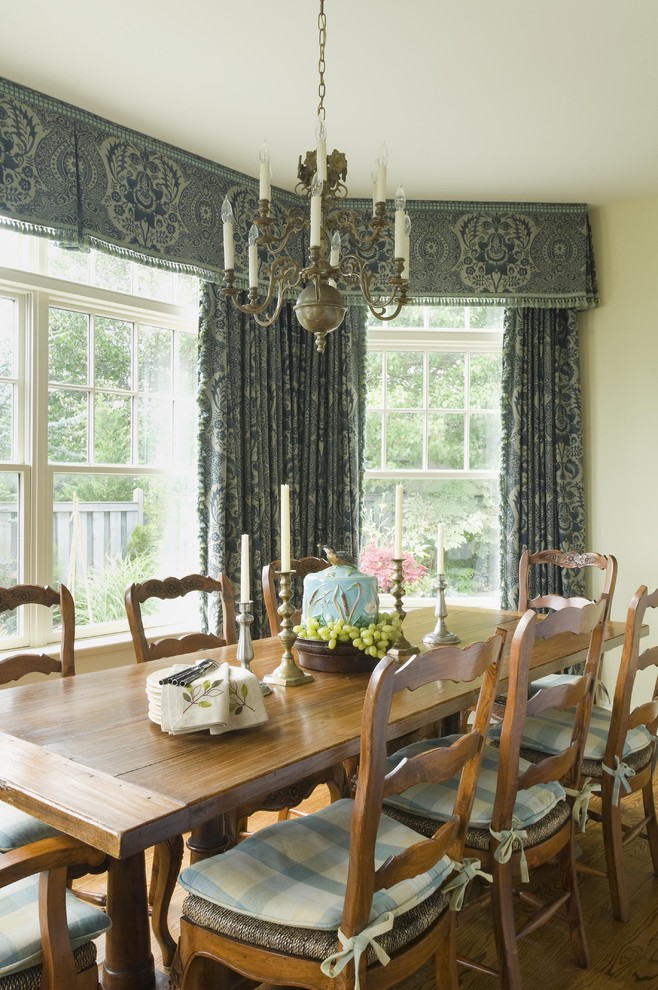 Design ideas for a country dining room in Newark with medium hardwood floors.