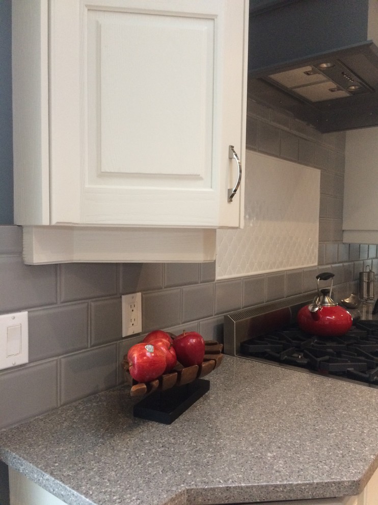 Example of a transitional kitchen design in Calgary