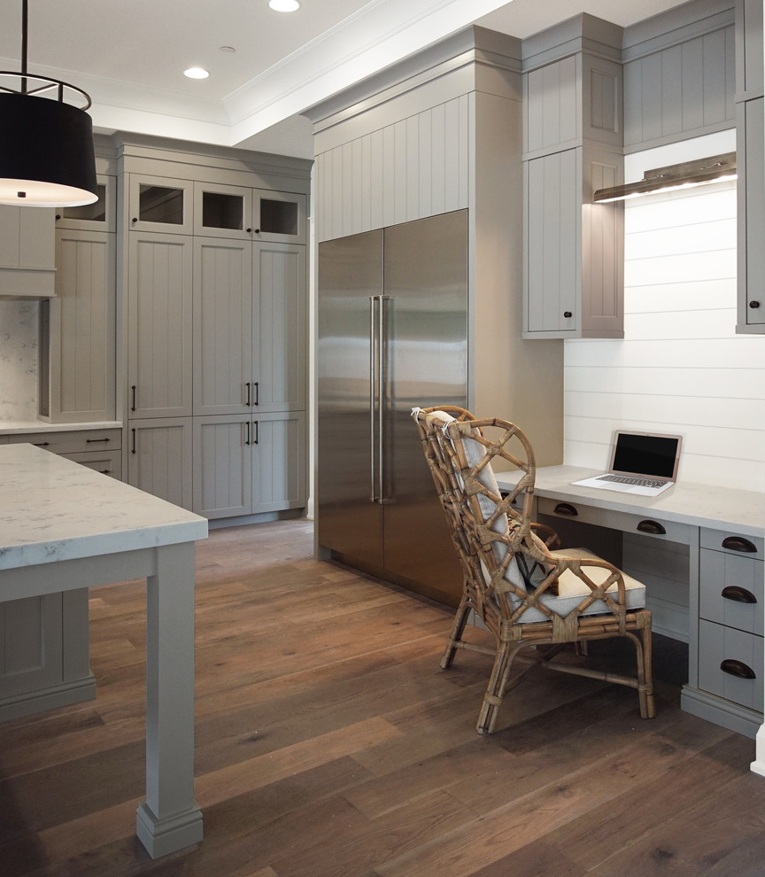 Design ideas for a large traditional l-shaped eat-in kitchen in Phoenix with a farmhouse sink, louvered cabinets, grey cabinets, quartzite benchtops, white splashback, stone slab splashback, white appliances, dark hardwood floors, with island and brown floor.