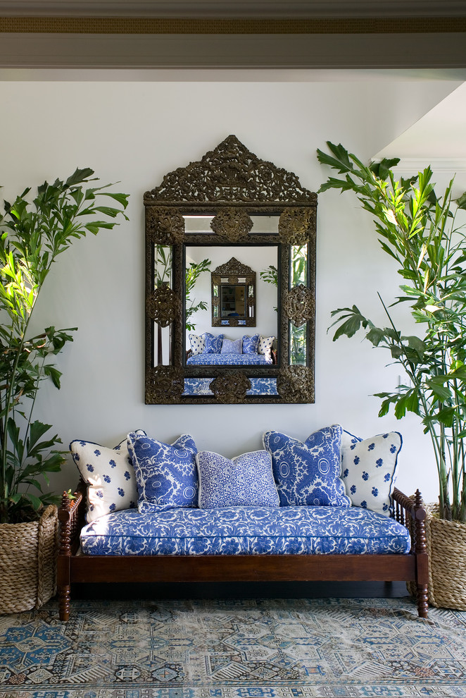 Inspiration for a tropical entryway in Jacksonville with white walls.
