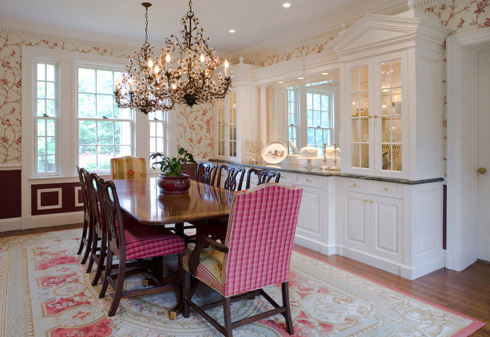 This is an example of a traditional separate dining room in New York with multi-coloured walls and dark hardwood floors.