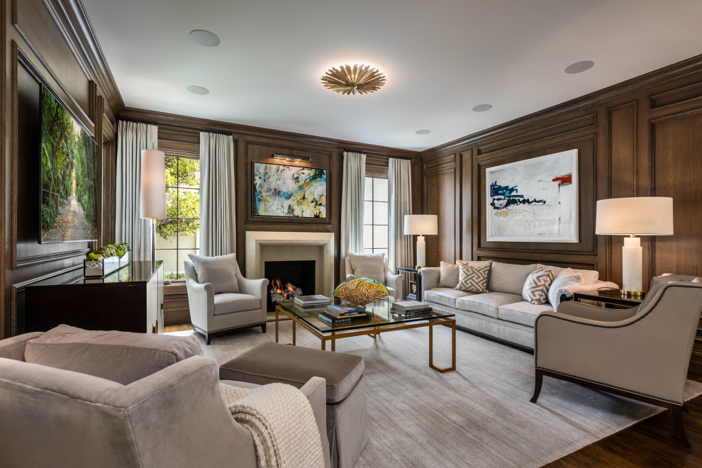 Design ideas for a large transitional enclosed family room in Other with brown walls, dark hardwood floors, a standard fireplace, a wall-mounted tv, a stone fireplace surround and brown floor.