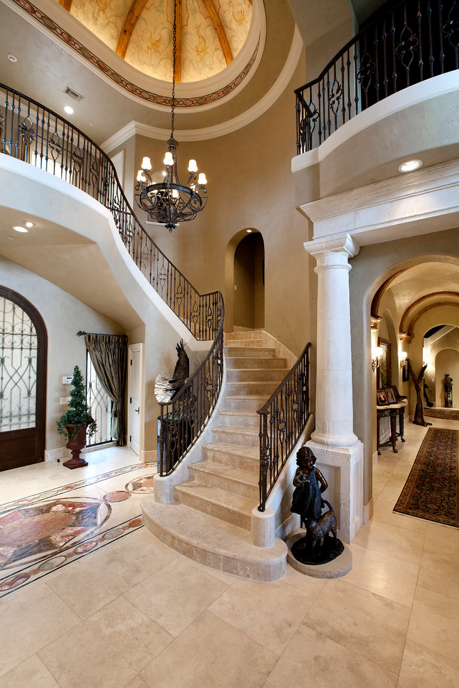 Mediterranean travertine curved staircase in Dallas with travertine risers.