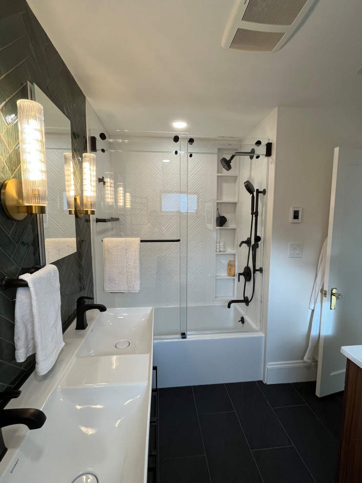 Photo of a mid-sized midcentury master bathroom in Boston with flat-panel cabinets, dark wood cabinets, an alcove tub, a shower/bathtub combo, a two-piece toilet, green tile, ceramic tile, white walls, porcelain floors, a console sink, solid surface benchtops, grey floor, a sliding shower screen, white benchtops, a double vanity and a freestanding vanity.